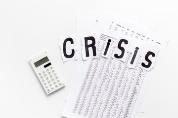 Financial crisis concept with calculator on white background top view