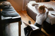 © JustLife - Young businesswoman working on lap top. Beautiful woman working in hotel room.