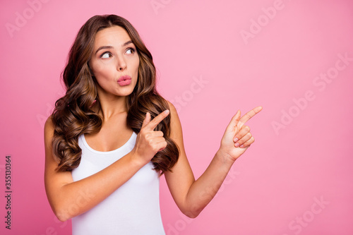 Cuadros en Lienzo Photo of charming wavy lady sales manager indicate fingers hands side empty spac