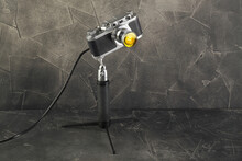 A Vintage Lamp Made By Me From An Old Rangefinger Film Camera Zorki Relased On 1955 On A Gray Cement Background.