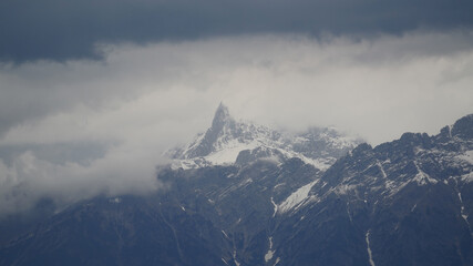 beautiful scenery on the evening with dark storm clouds on the alps in austria