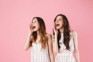 Poster - Image of cheerful beautiful women looking and screaming aside