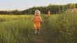 © EVERST - Toddler girl walking outdoor with mother family vacations child traveling eco tourism happy smiling emotions summer season nature