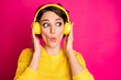 © deagreez - Portrait of astonished funny crazy girl have yellow headset listen unbelievable music impressed look copyspace wear jumper isolated over bright color background