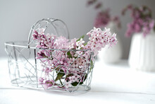 Lilac Flowers In Metallic Basket On White Table. Summer Flowers And Perfume Ingredient. French Lilac Aroma. Poster Or Calendar Page. 