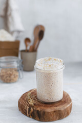 Close-up of jar with natural homemade sourdough levain starter for homemade bakery