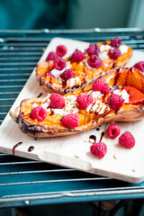 Wall Mural - Roasted Pumpkin with Cream Cheese, Raspberries, Pine Nuts and Balsamic Sauce, Healthy Salad