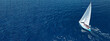 © aerial-drone - Aerial drone ultra wide photo of beautiful sail boat with white sails  sailing open ocean deep blue sea