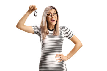 Poster - Happy young woman holding a car key