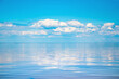 Seascape background vivid blue sky with clouds reflect in sea
