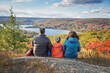 © romylee - family taking in a scenic spot in the fall in New England