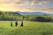 © romylee - Family hiking in a beautiful scenery at sunset