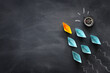© tomertu - Leadership banner concept with paper boat on blackboard background. One leader ship leads others
