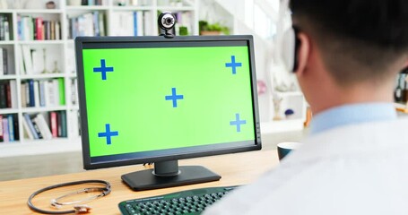 man watch green screen computer