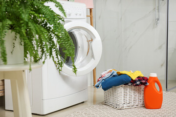 Wall Mural - Wicker basket with laundry, detergent and washing machine in bathroom