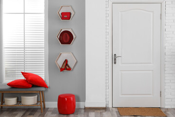 Sticker - Shelves with different accessories on grey wall in hallway. Interior design