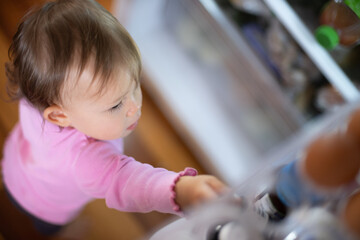 Child reaching in refridgerator