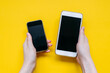 © Bostan Natalia - Old and new smartphone comparison on yellow background.