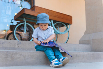 Wall Mural - boy on stairs with book