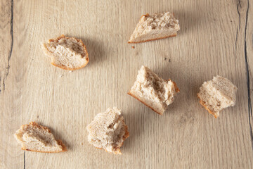 Sticker - Bread crumbs on a wooden table.