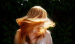 © ullision - beautiful sexy redhead woman ginger, shaking her flying long hair against the sunny backlight