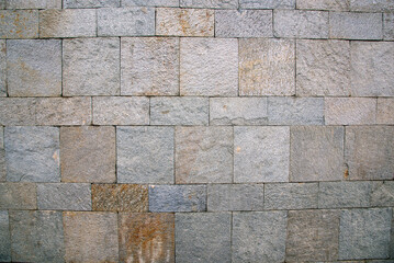 The masonry of the ancient wall consists of regular-shaped stone blocks