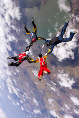 Sports parachutist build a figure in free fall. Extreme sport concept.