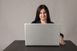 © Marijus - Young woman in blue with laptop.