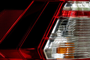 Wall Mural - Close up of car rear lamp with red and white glass indicates luxury.