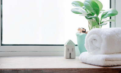 clean towels on wooden table in bathroom.