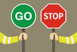 © flatvectors - Outdoor worker holding stop and go sign. Hand hold traffic or road sign. Close-up view. Flat vector illustration.
