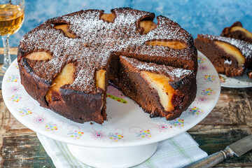 Canvas Print - chocolate cake with pears dusted with icing sugar