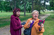 © banedeki1 - Two women are phoning in the park