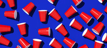 Minimal Creative Composition For Beverage And Party Concept. Red Plastic Solo Drinking Cup On Blue Background. 3d Rendering Illustration. Object Isolate Clipping Path Included.