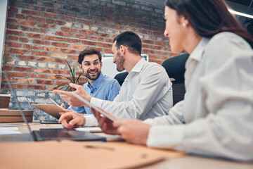 Wall Mural - Happy colleagues are working in modern office