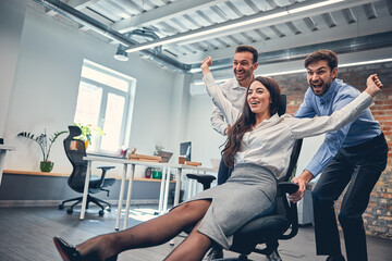 Wall Mural - Happy carefree employees having fun and laughing