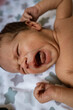 © Alaphotography - Newborn baby boy lying on bed