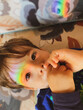 © EZ PHOTOS - A baby boy with light rainbow on his face during Covid-19 quarantine at home. Stay at home Social media campaign for coronavirus prevention, hope during coronavirus pandemic concept.