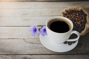 black coffee in a coffee cup top view isolated on wood background.