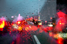 Motorway Traffic Jam Caused By An Accident On A Wet Road. View Through A Rainy Windscreen To The Roadway