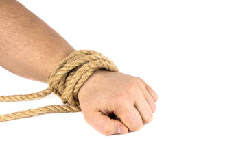 A man's hand is tied with a rope isolated on a white background. Bound hand. Modern slavery