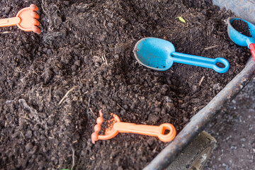 Soil for planting and gardening toy tools.