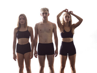 group portrait of athletic dance partners in front of white background