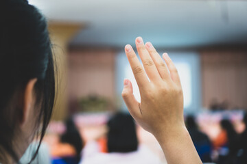 Wall Mural - Business event with audience in conference hall while speaker giving talk in meetning hall. Business Woman raising hands for ask tutor traning in lecture public.