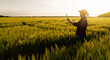 © scharfsinn86 - Farmer with digital tablet on a rye field. Smart farming and digital transformation in agriculture.