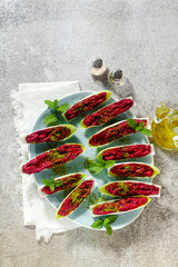 Wall Mural - dip of boiled beets and pistachios in leaves of Belgian Endive with mint. healthy summer snack