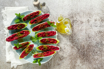 Wall Mural - dip of boiled beets and pistachios in leaves of Belgian Endive with mint. healthy summer snack