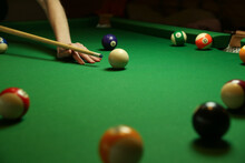 Billiard Background With Color Pool Balls And Cues On Green Table