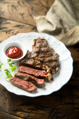 Canvas Print - Grilled beef steak with tomato sauce