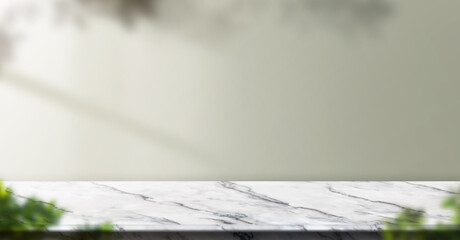 Fototapete - marble table background with sunlight window create leaf shadow on wall with blur indoor green plant foreground.panoramic banner mockup for display of product